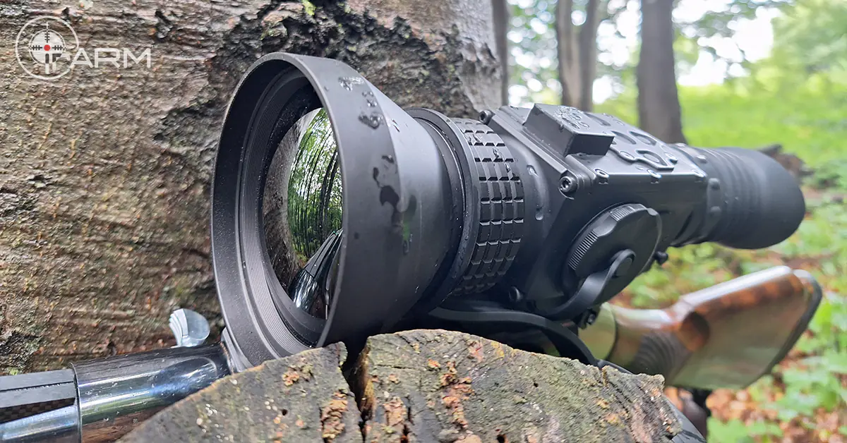 Dirty Thermal Scope Lens Hawk put on a tree in the forest after use